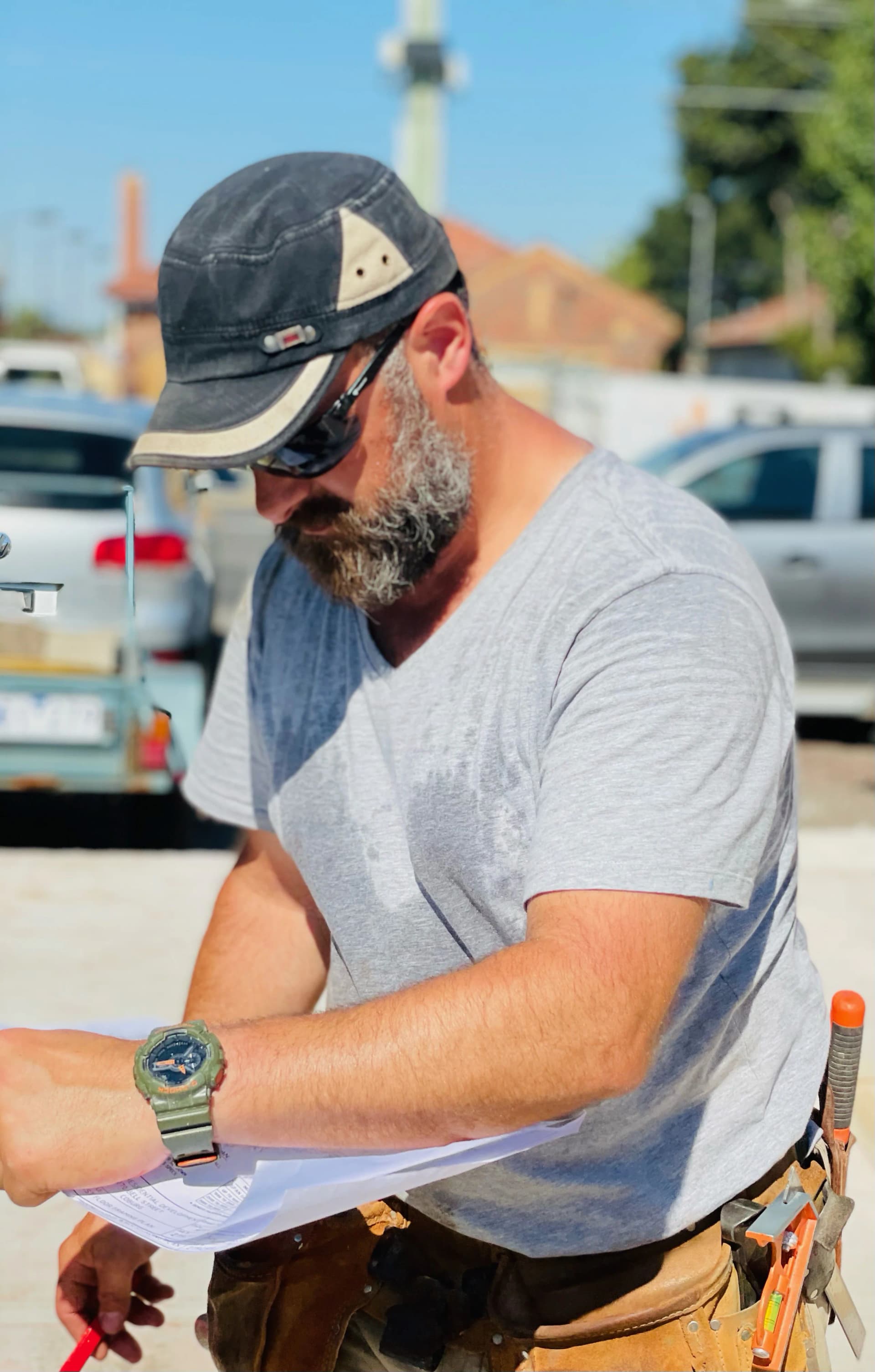 Katsaros Build director reviewing plans on a Melbourne luxury residential site