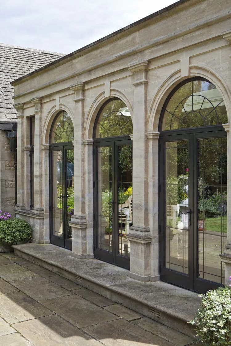 Stone facade and integrated landscape architecture by luxury home builders Melbourne, Katsaros Build